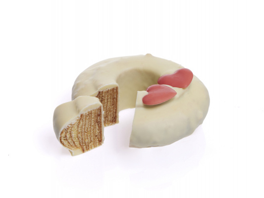 Der weiße Baumkuchen ist angeschnitten. Der Link führt zu einer größeren Darstellung von diesem Bild.